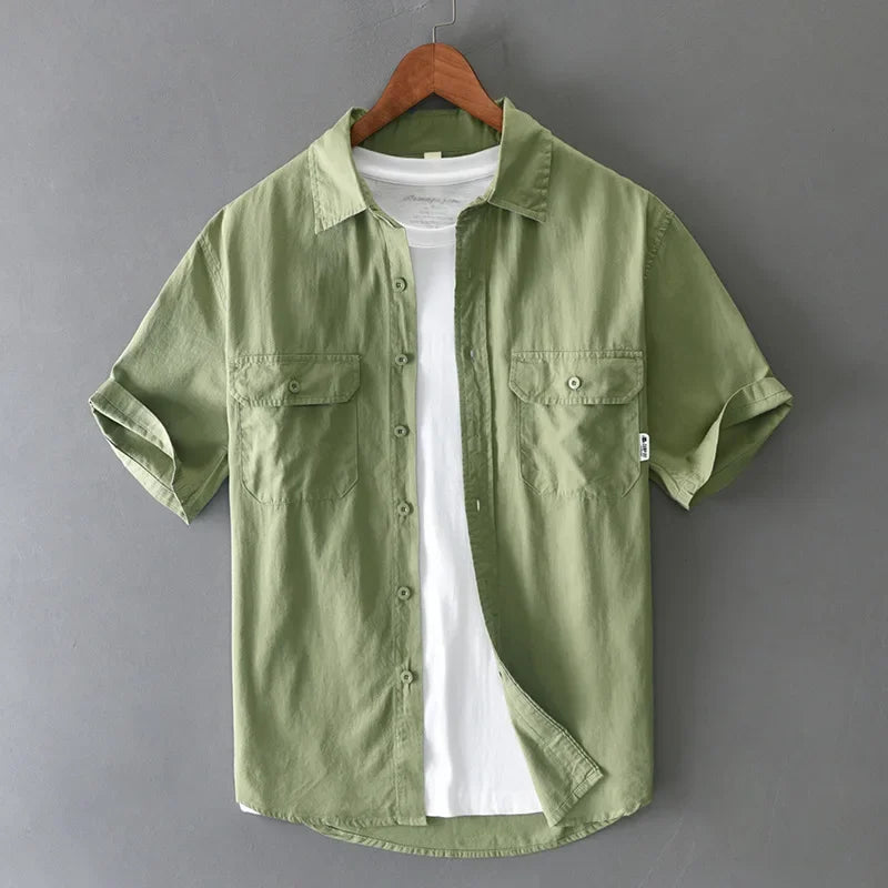 Green men's short sleeve fishing shirt, twin-pocket design, perfect for fishing, hiking, and outdoor adventures.