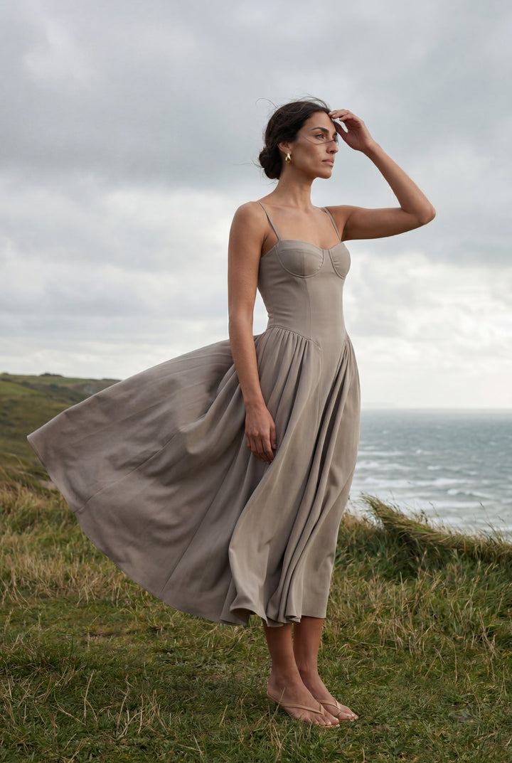 Summer occasion wear: women's floral A-line midi dress with corset styling.