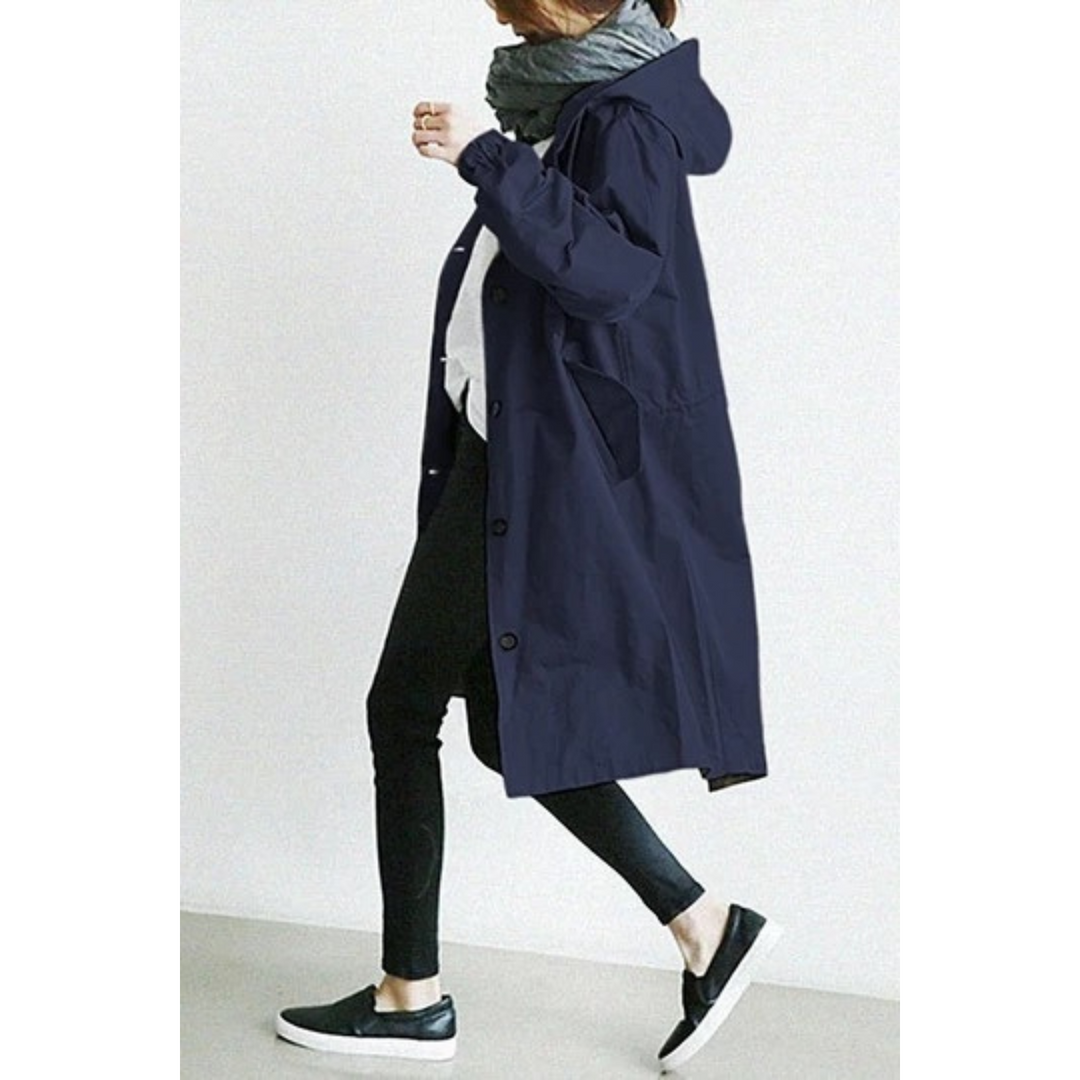 Stylish women's long hooded trench coat. Versatile weatherproof outerwear for ladies, ideal for fall & winter.