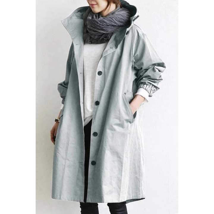 Versatile women's long hooded trench coat. Weatherproof fashion outerwear, perfect for ladies' fall and winter style.