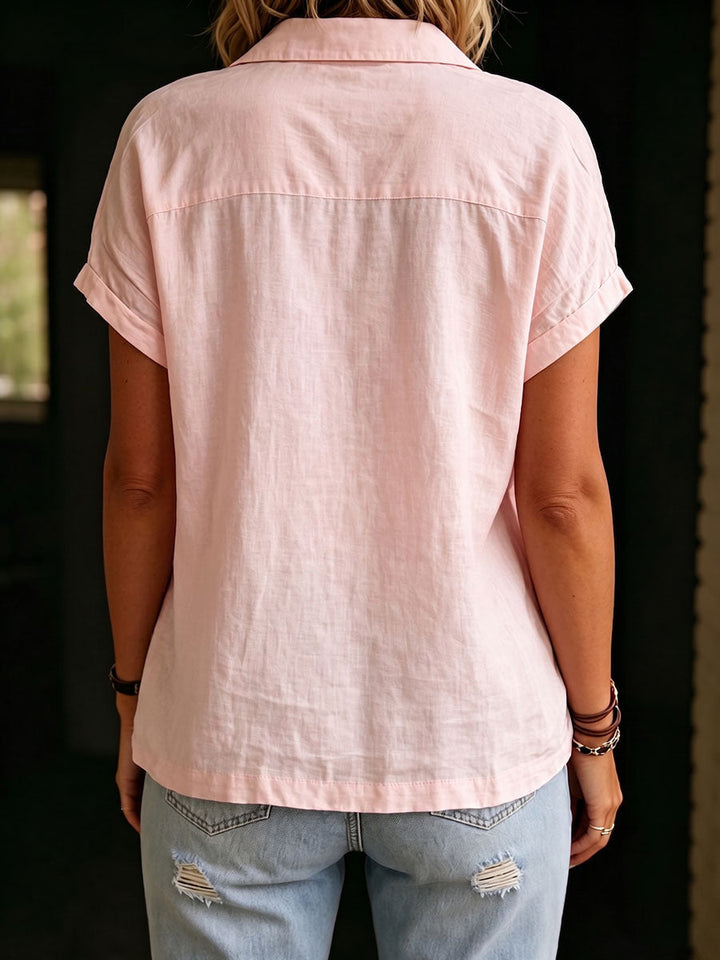 Women's pink collared blouse, a sophisticated casual top with front pockets. Perfect relaxed fit for summer or workwear chic.