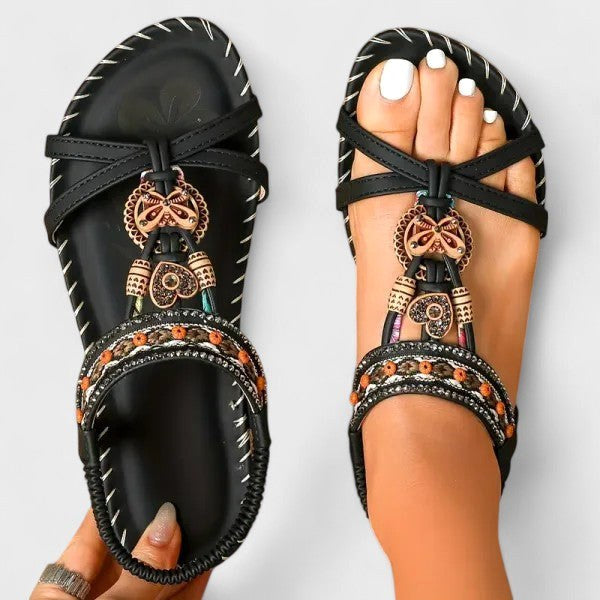 Chic bohemian women's T-strap flat sandals. Ankle strap & arch support for casual summer comfort.