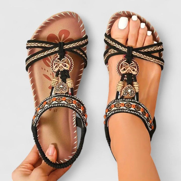 Chic bohemian T-strap flat sandals for women. Stylish & comfortable with orthopedic arch support.