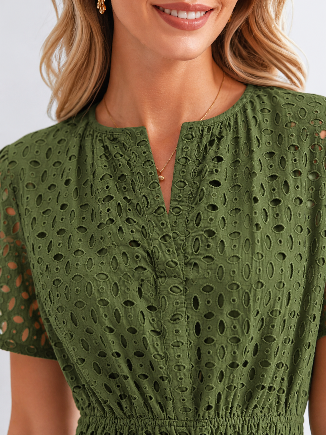 Flowy A-line midi dress for women, featuring delicate eyelet detail and a stylish tiered skirt. Summer essential.