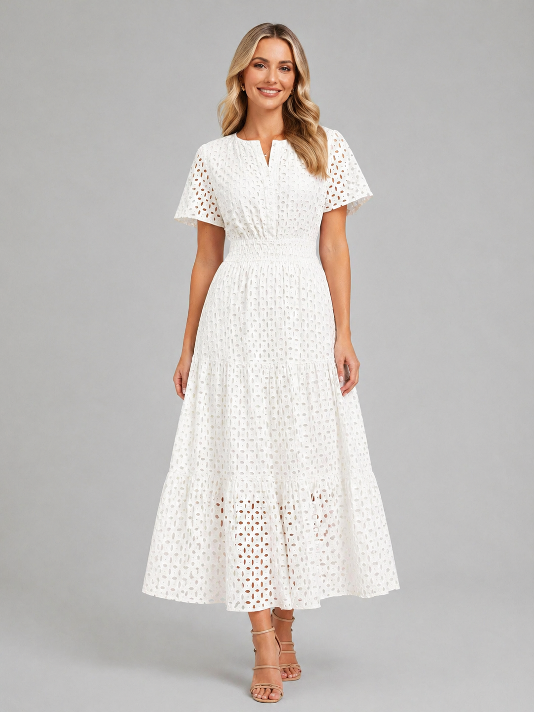 Casual women's eyelet A-line midi dress, ideal for vacation outfits or comfortable daytime wear. Effortless style.