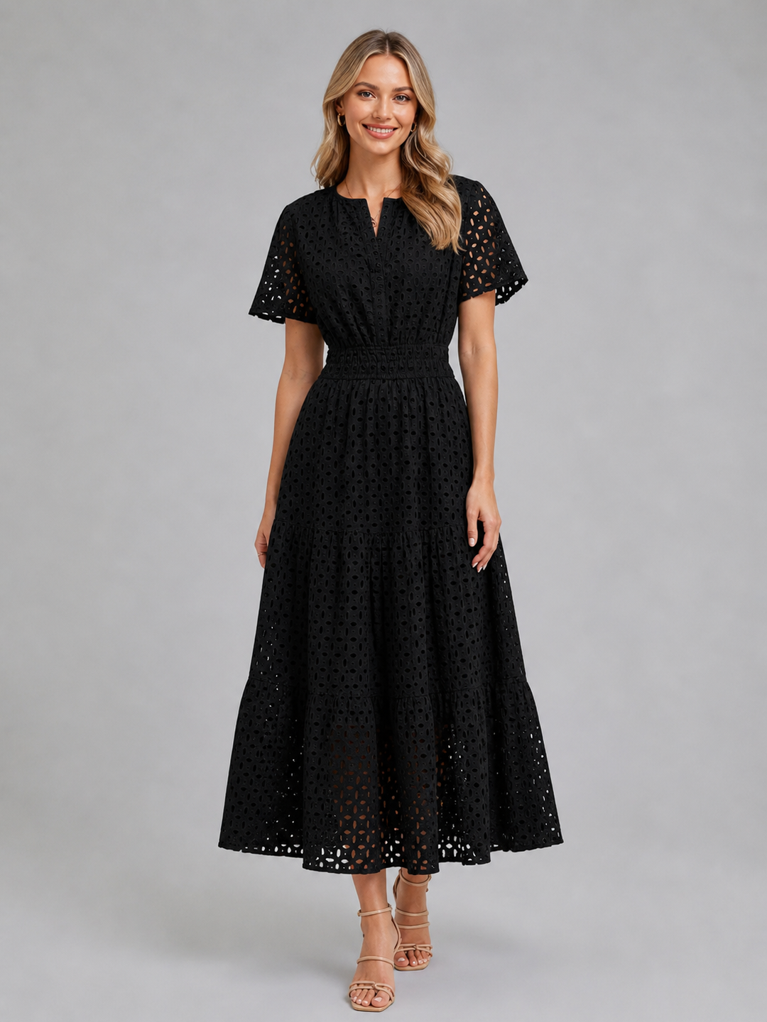 Comfortable women's A-line eyelet midi dress, designed with a tiered skirt and flutter sleeves for effortless summer style.