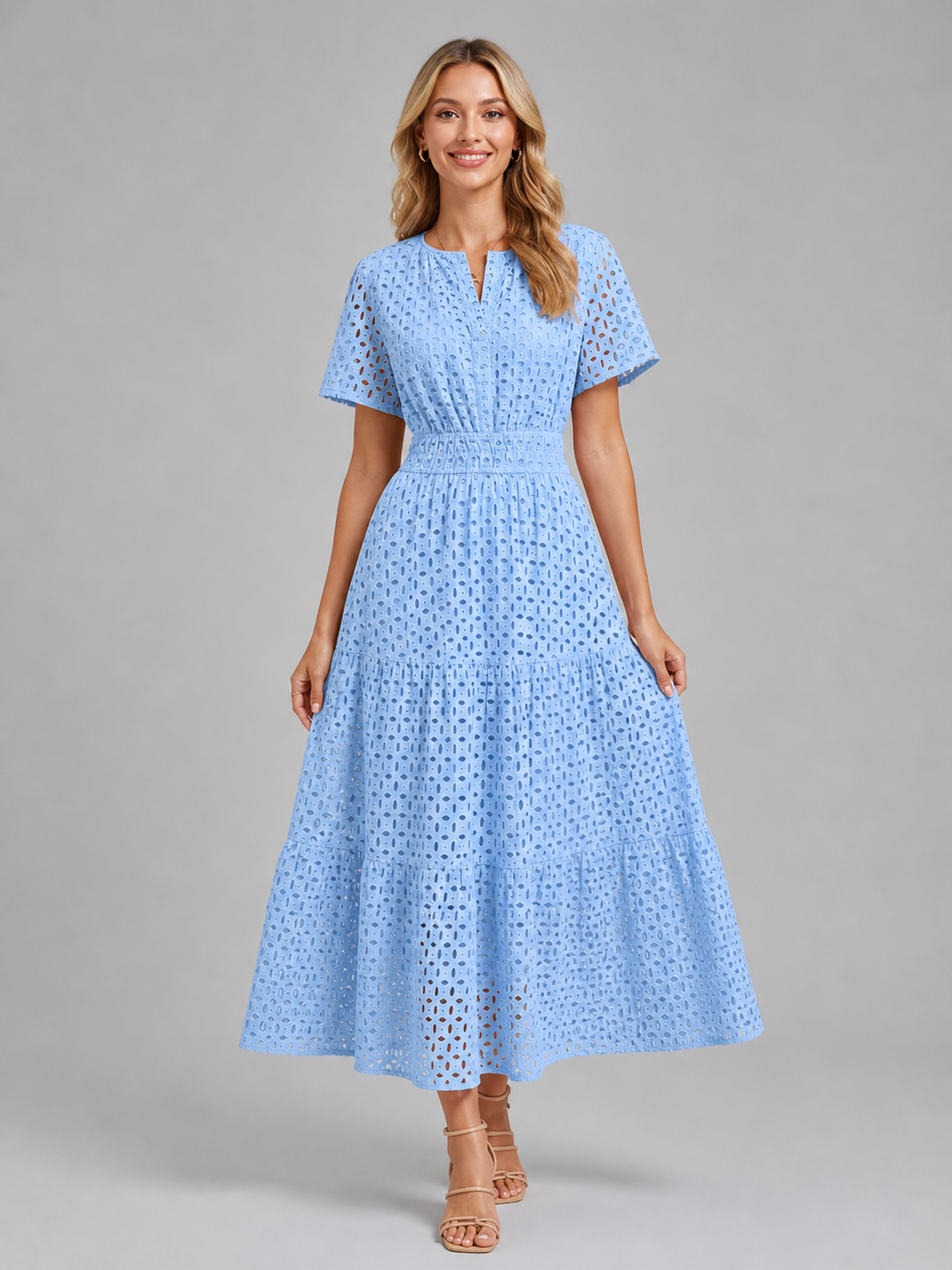 Flattering women's A-line midi dress with intricate eyelet details, a tiered skirt, and flutter sleeves for an elegant fit.