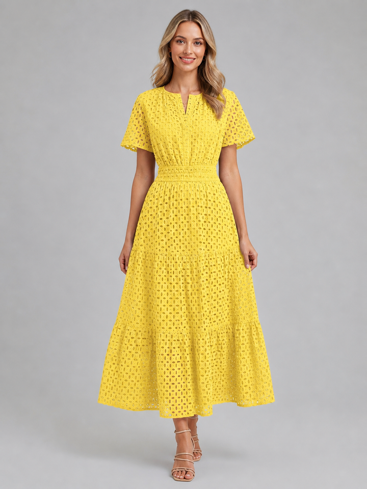 Elegant yet casual women's eyelet A-line midi dress with tiered skirt and flutter sleeves. Perfect daytime and vacation wear.