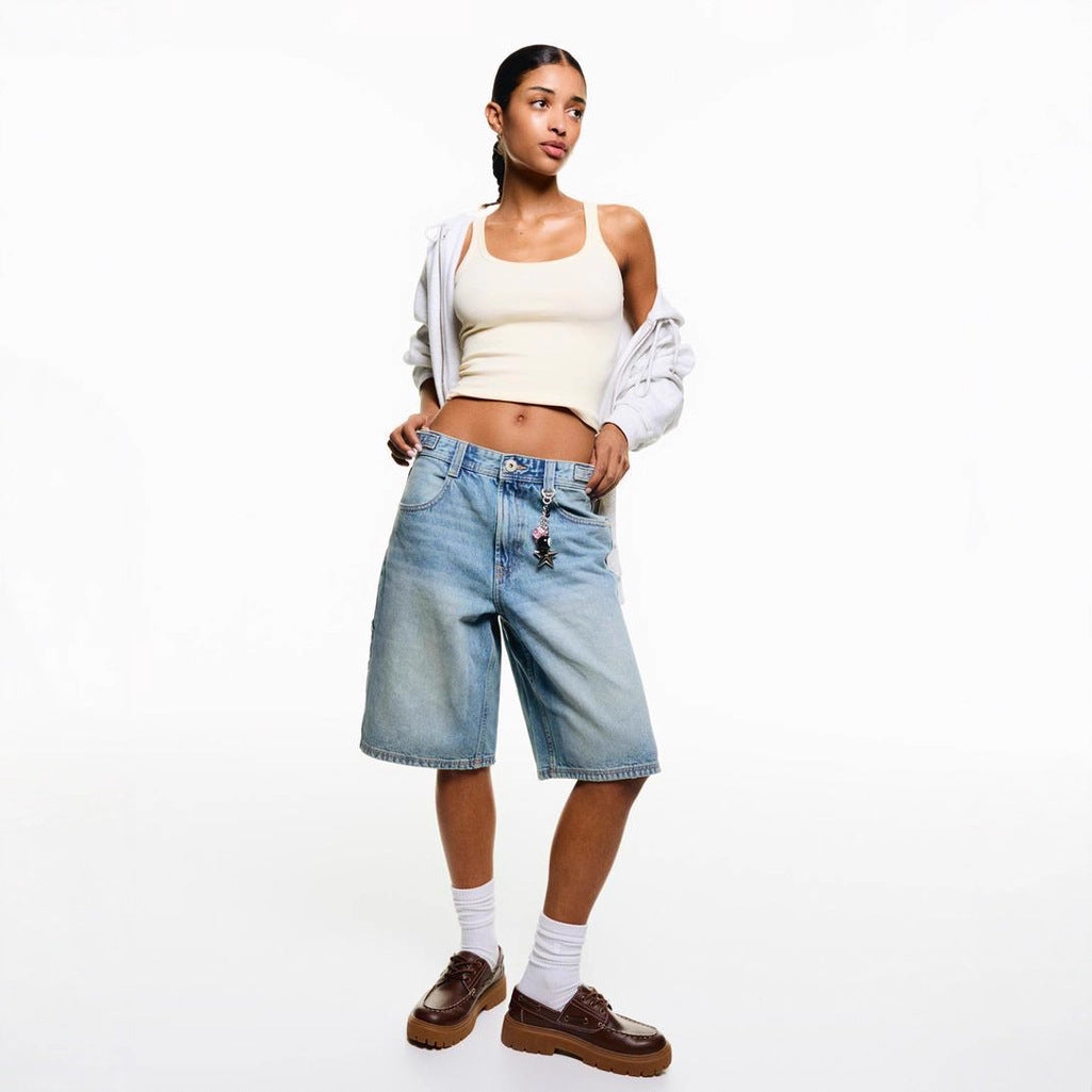 Grey high-waisted relaxed fit women's denim shorts, ideal for effortless summer fashion.