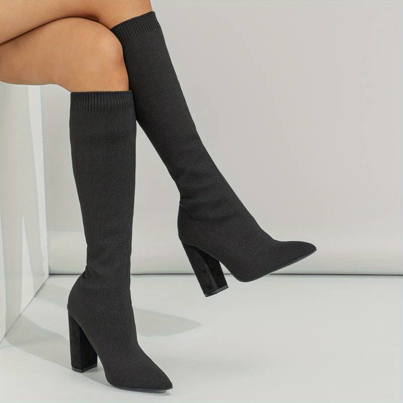 Women's knee-high sock boots by Solid Stature, elegant fall fashion footwear.