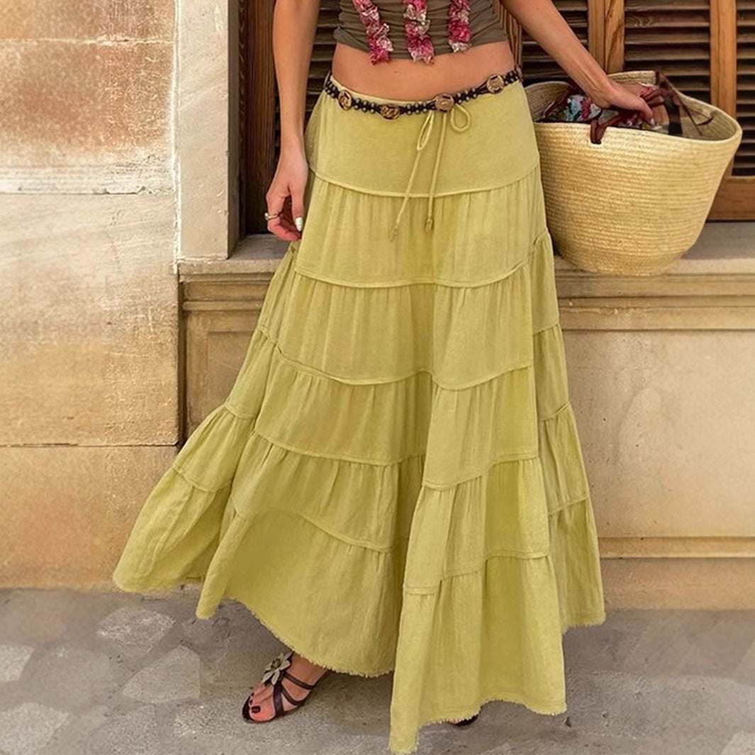 Women's tiered boho midi skirt with elastic waist, perfect for summer casual outfits & beach wear.