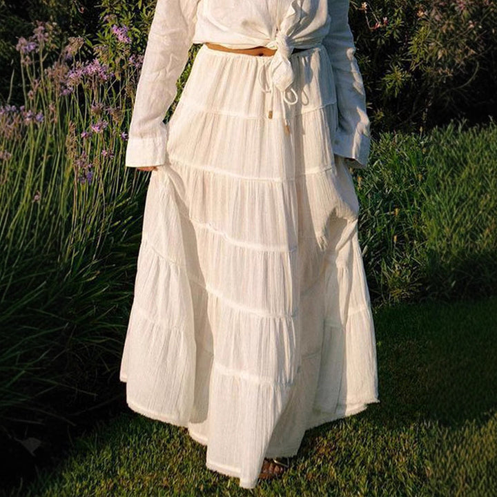 Timeless women's tiered boho midi skirt, a versatile piece for casual, beach, and summer outfits.