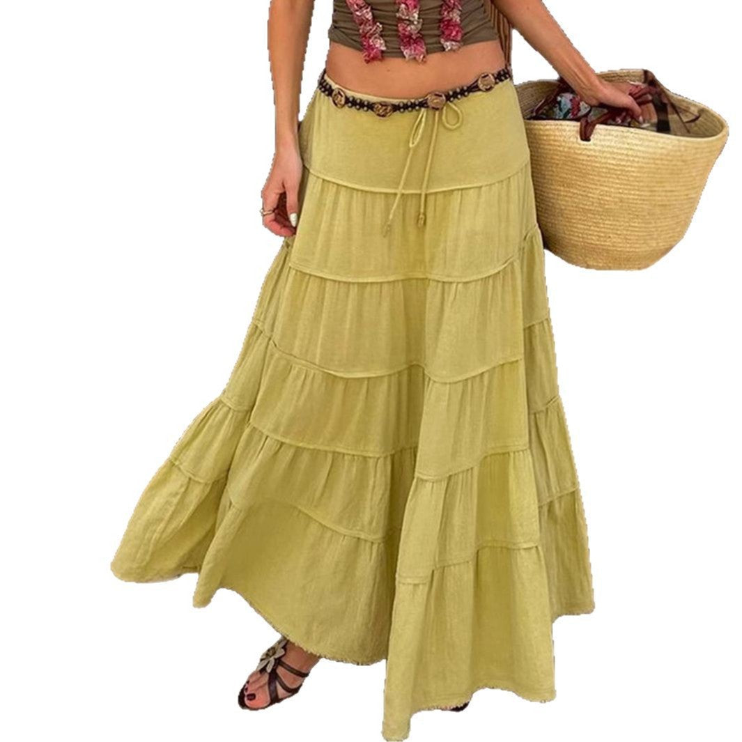 Woman wearing a relaxed fit tiered boho midi skirt, perfect for a stylish summer or weekend look.