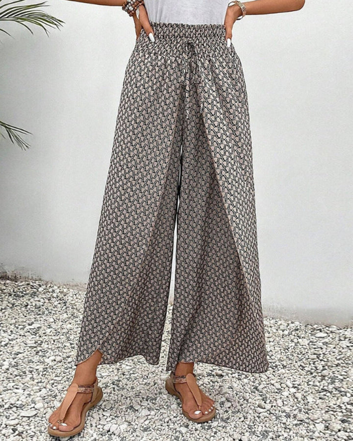 Stylish women's wide leg pants featuring a unique geometric print, high waist, and flowy design.