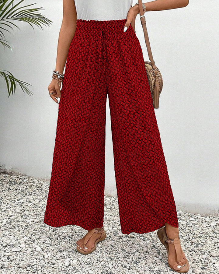 Front view of women's flowy geometric print wide leg pants, showcasing the soft fabric and stylish drape.