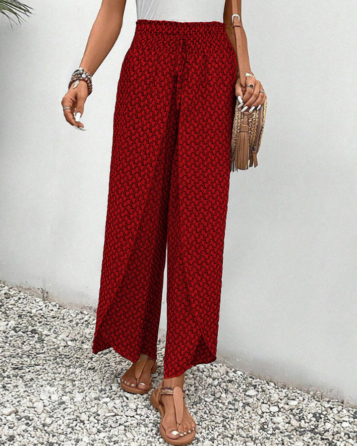 Back view of women's comfortable wide leg pants with a geometric print, designed for movement & style.