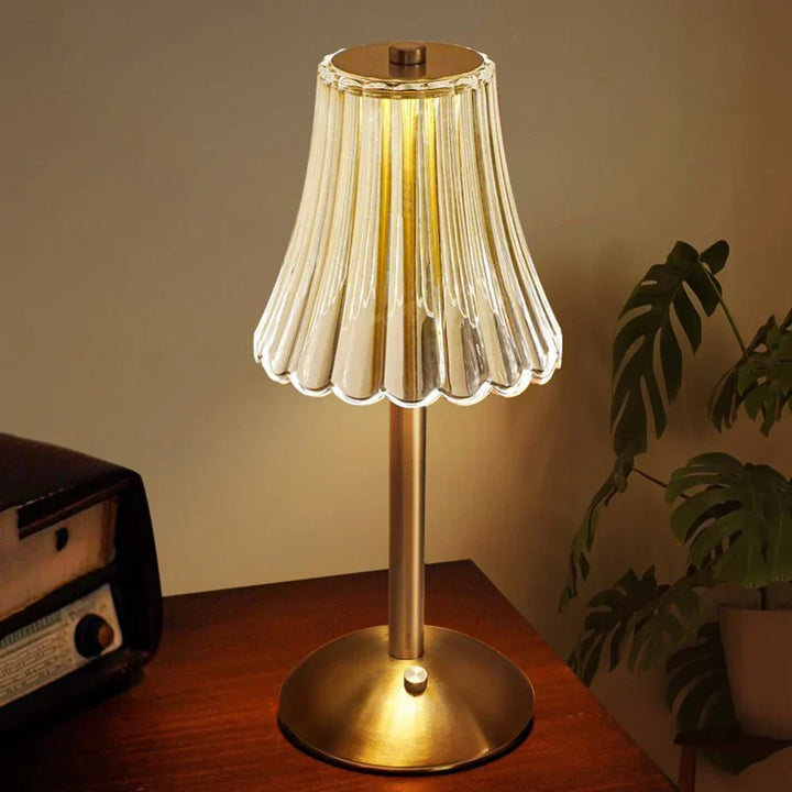 Sophisticated LED crystal lamp, touch activated, featuring a stunning gold base.