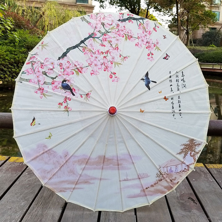 Traditional Japanese paper sun umbrella with UV protection & a stylish bamboo handle, perfect for sun protection.