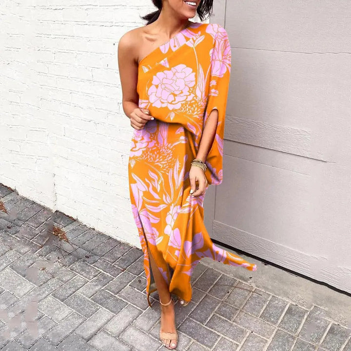 Women's elegant floral one-shoulder maxi race dress. Flowy, relaxed fit, perfect for summer occasion wear.