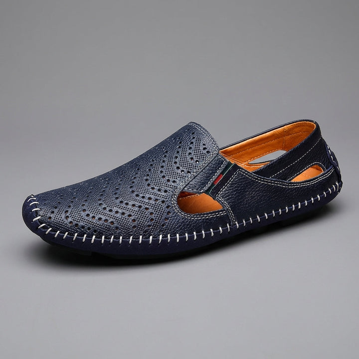 Stylish men's slip-on sandals, perforated design & unique woven detail, ideal for vacation.