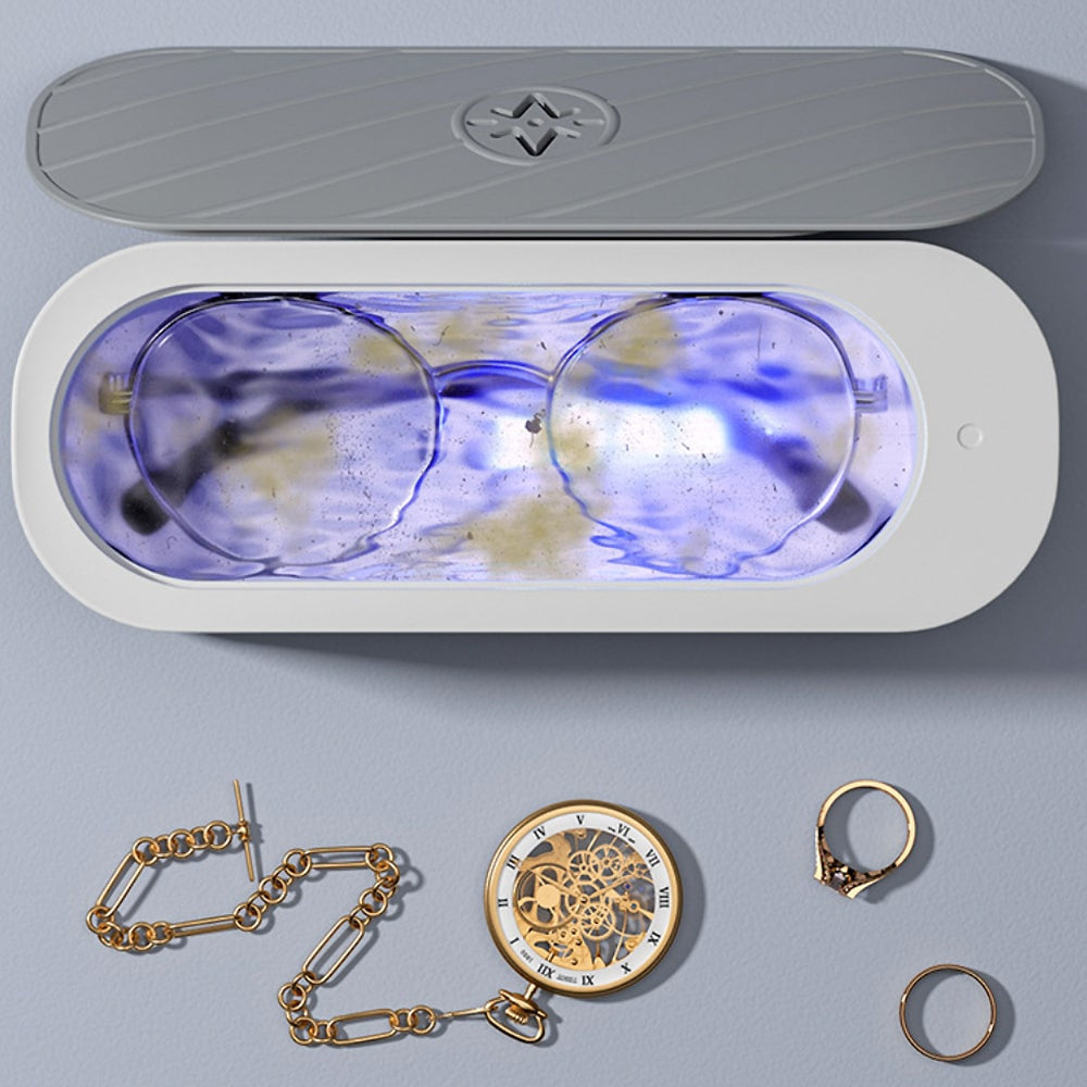 Ultrasonic jewelry, eyeglass & watch cleaner machine. Gentle home gadget for sparkle restore & valuable cleaning.