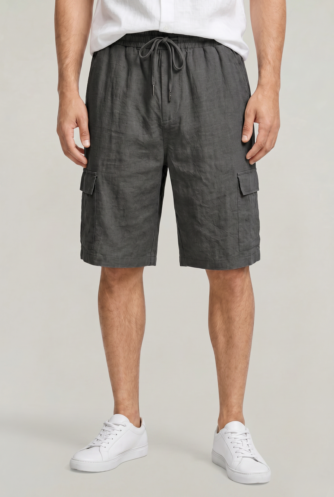 Stylish men's knee-length cargo shorts. Polished fabric, drawstring waist, and spacious utility pockets for summer.