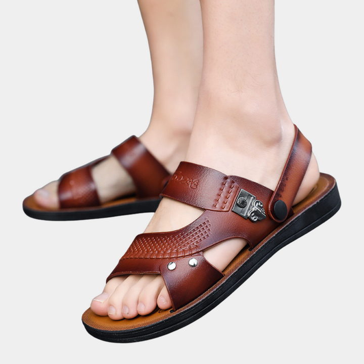 Dark brown men's slides with riveted buckle strap. Stylish & comfortable summer sandals for casual wear.
