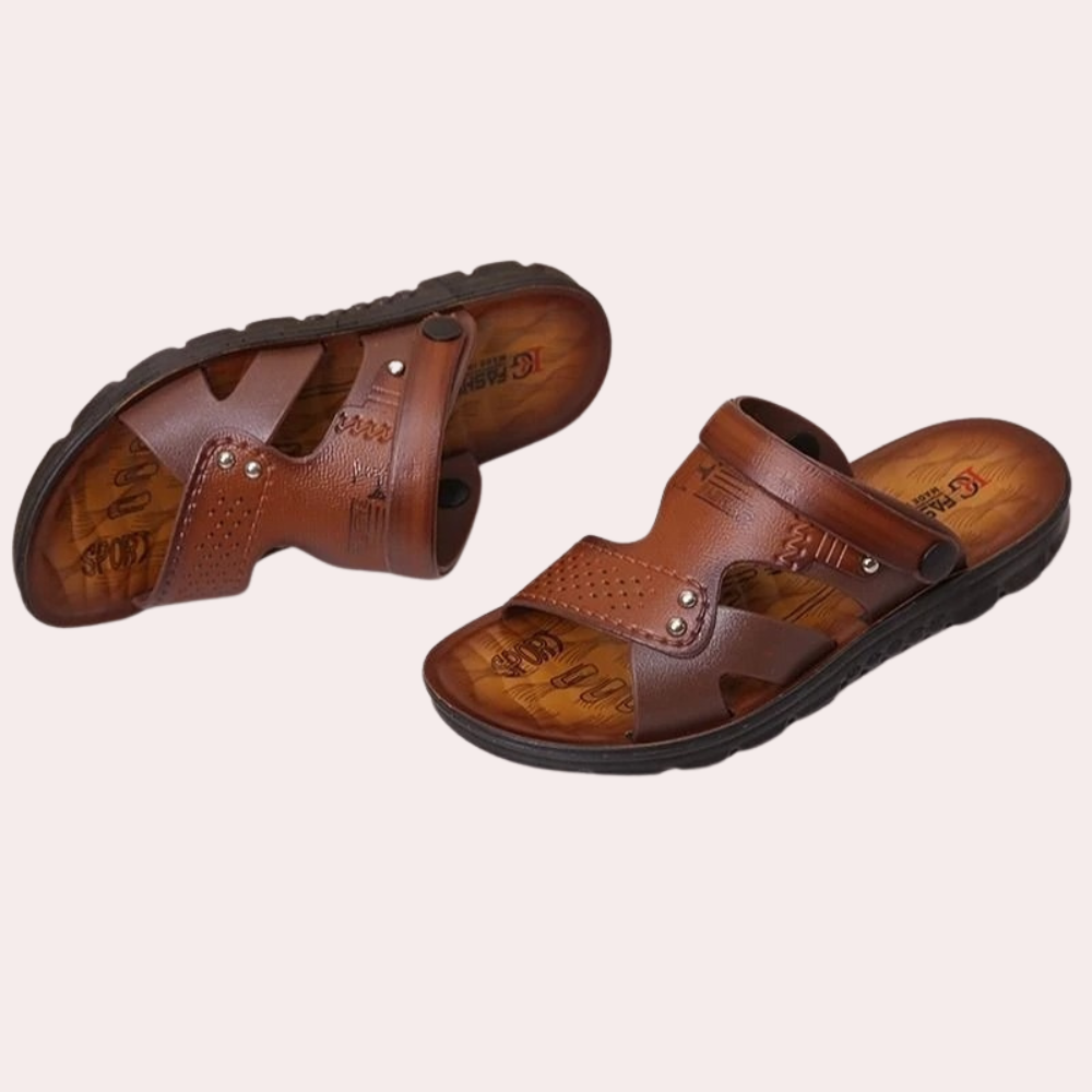 Comfortable men's dark brown slides with riveted buckle. Essential summer shoes for relaxed weekend wear.