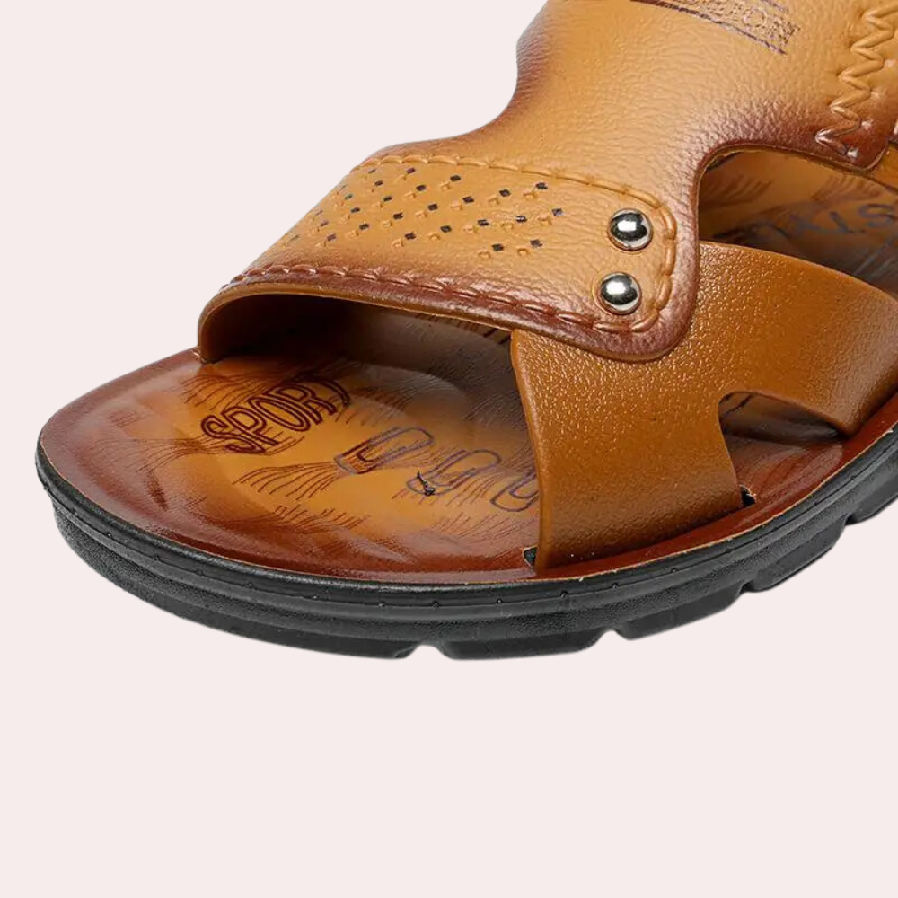 Men's open-toe dark brown slides with unique riveted buckle. Versatile casual footwear for any summer occasion.