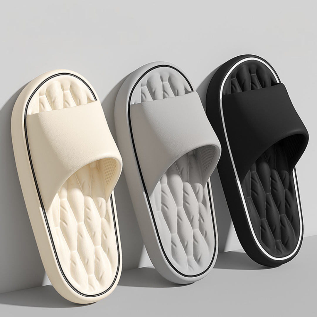 Relaxing men's slides with a cushioned design & soothing massage footbed. Perfect comfortable footwear for after-sport or lounge.