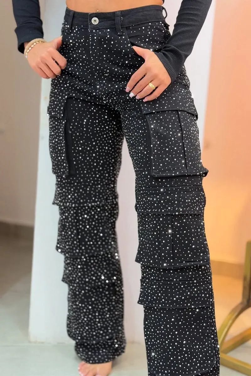 Close-up of dazzling rhinestone embellishments on women's stylish cargo denim jeans.