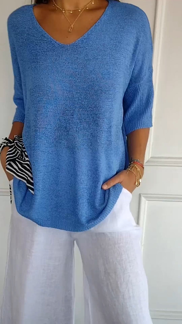 Modern women's V-neck top, long sleeve design offering both casual comfort and sophisticated elegance. [[lstfy-media:10]]