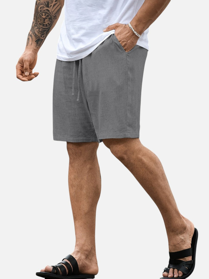 Versatile black men's linen shorts, drawstring, relaxed fit, ideal for casual everyday summer style.