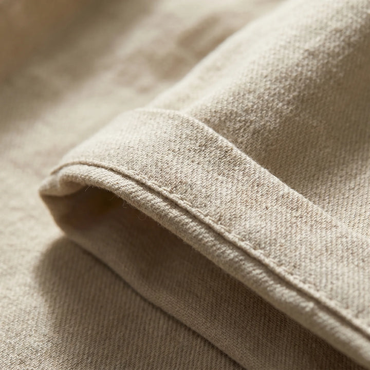 Comfortable men's linen pleated shorts with turn-up cuff. Tailored for classic summer style & everyday wear.