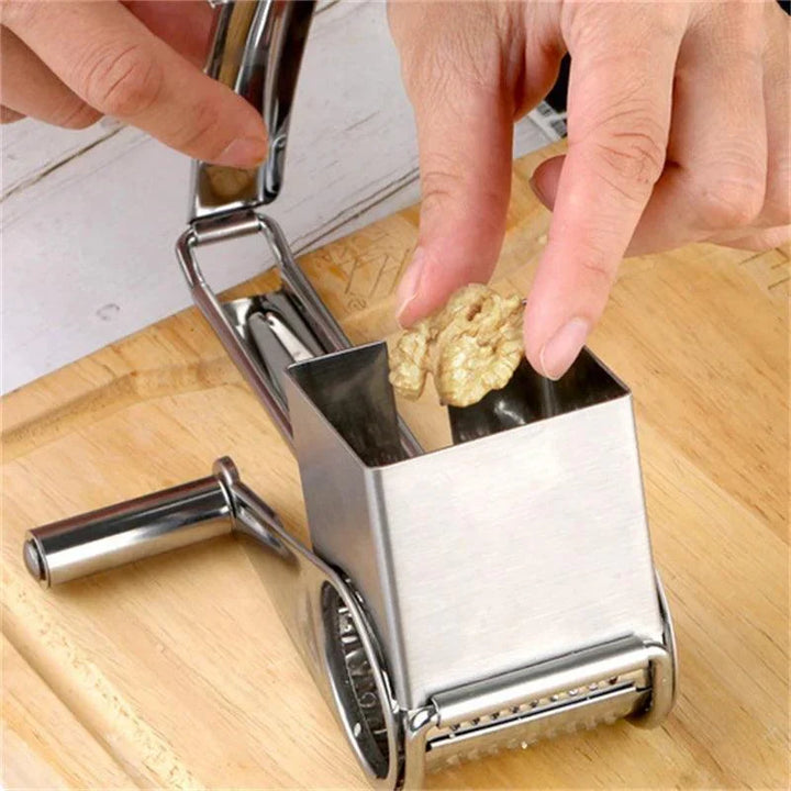 Durable manual rotary cheese & vegetable grater with stainless steel versatile drums for kitchen.
