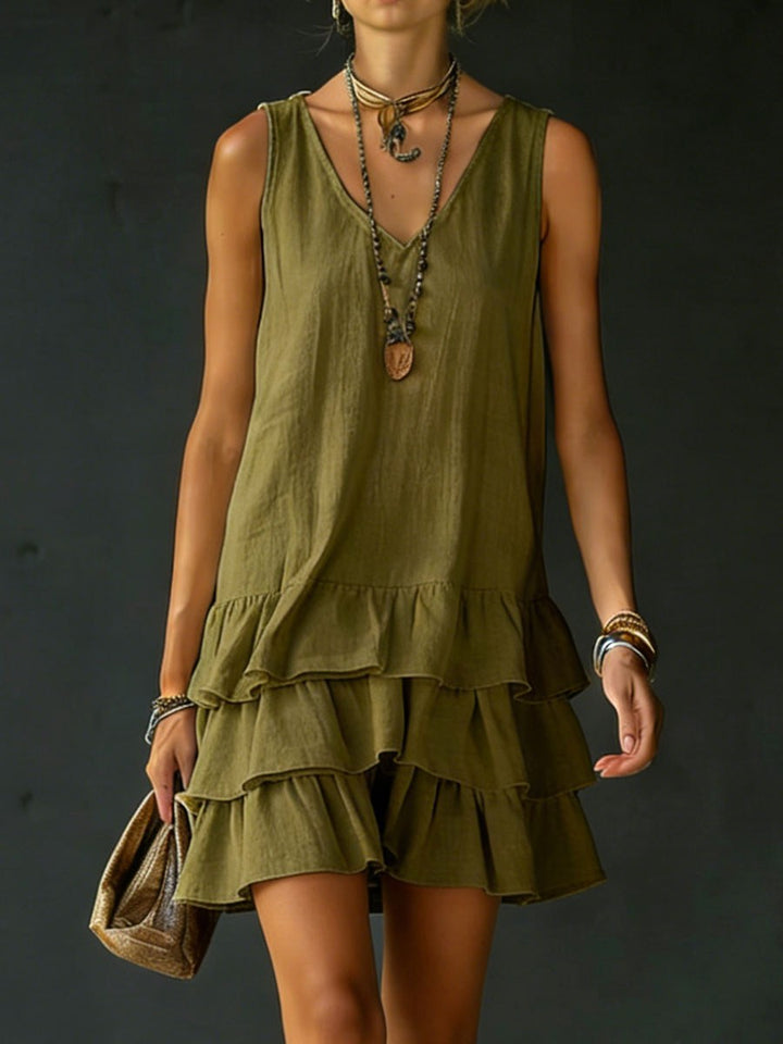 Lightweight women's sleeveless V-neck tunic dress, designed with a fashionable ruffle hem for summer comfort.