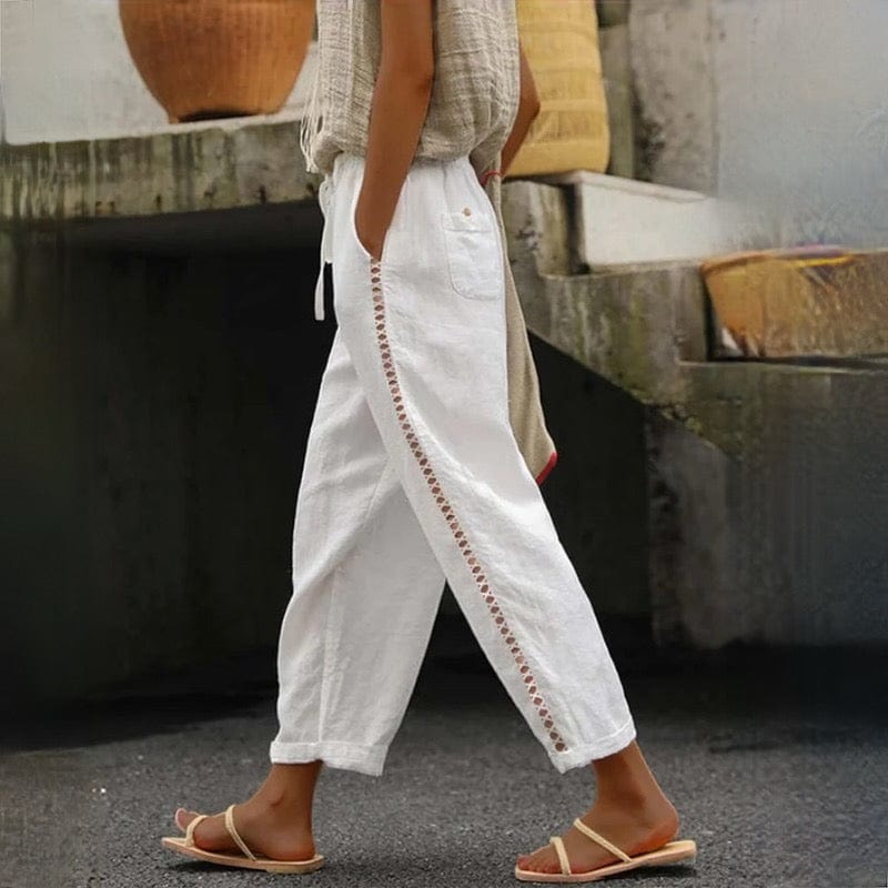 Women's chic linen cropped pants with comfortable elastic waist and delicate eyelet trim, perfect for summer casual wear.