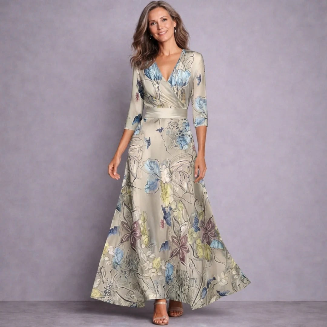 Elegant women's mid-sleeve floral print maxi dress. Flowing long design for comfortable everyday summer fashion.