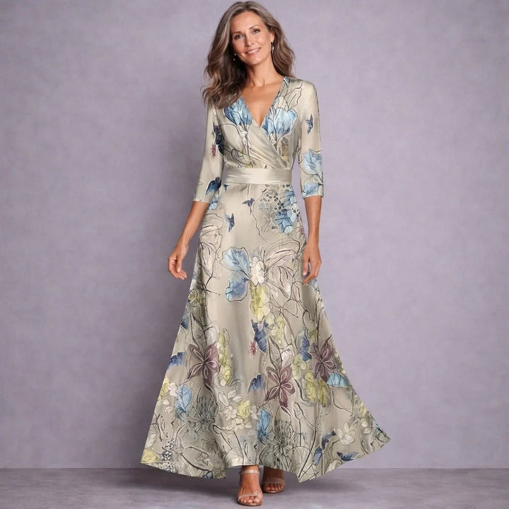 Elegant women's mid-sleeve floral print maxi dress. Flowing long design for comfortable everyday summer fashion.