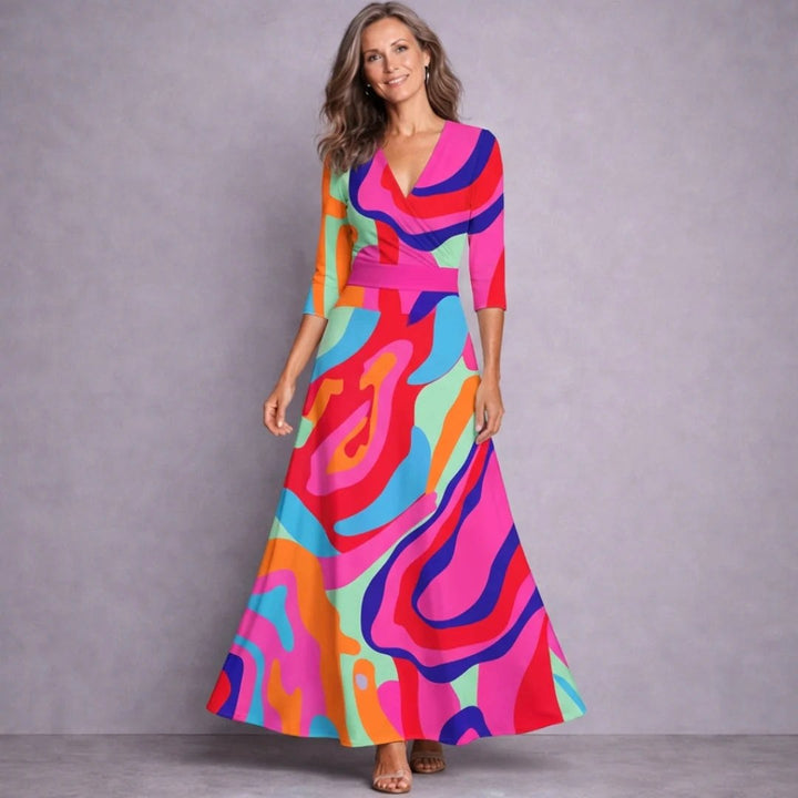 Flowing floral print maxi dress for women, featuring mid-sleeves. Versatile for elegant or casual spring & summer wear.