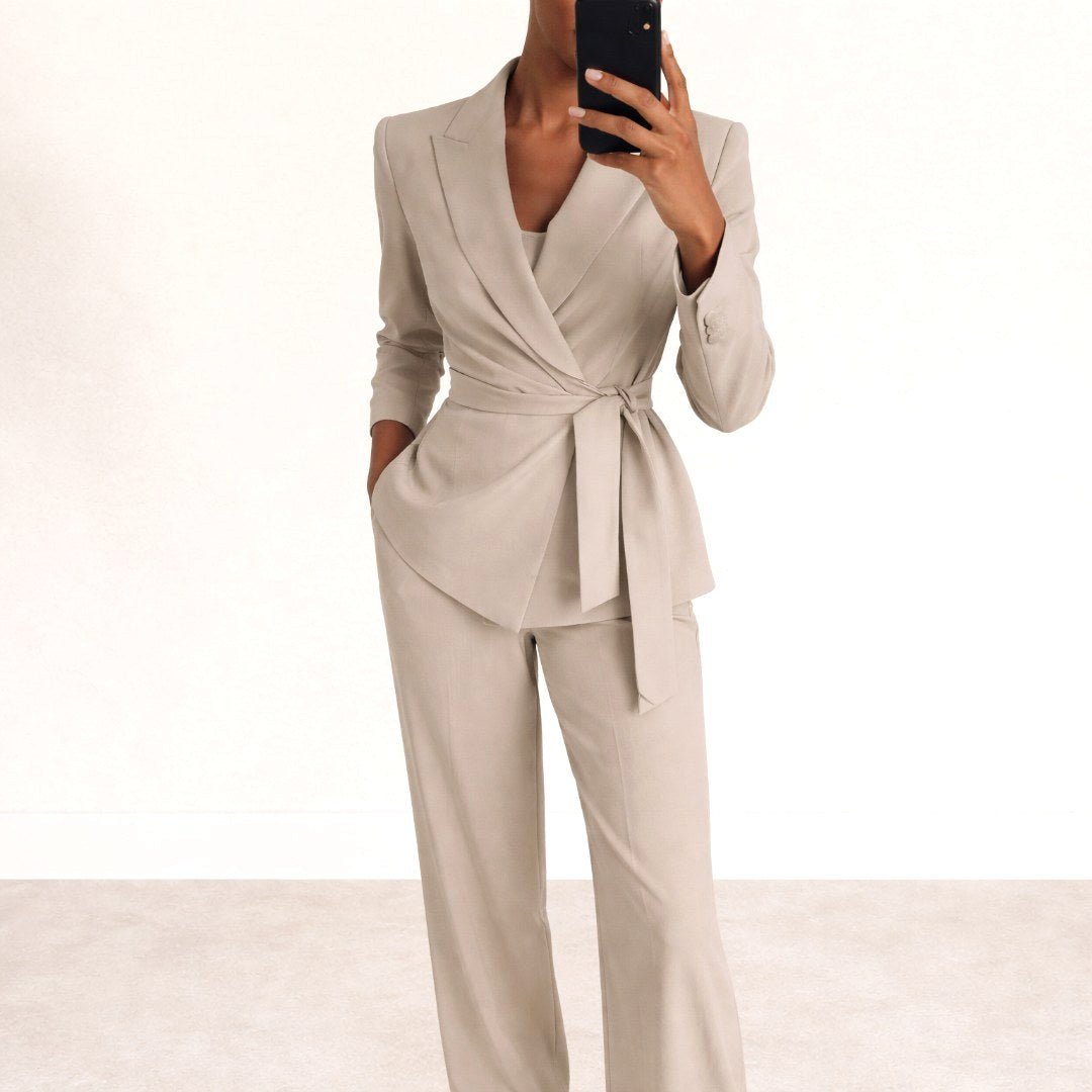 Chic women's two-piece trouser suit. Belted top & comfortable wide-leg pants for a versatile, modern ensemble.