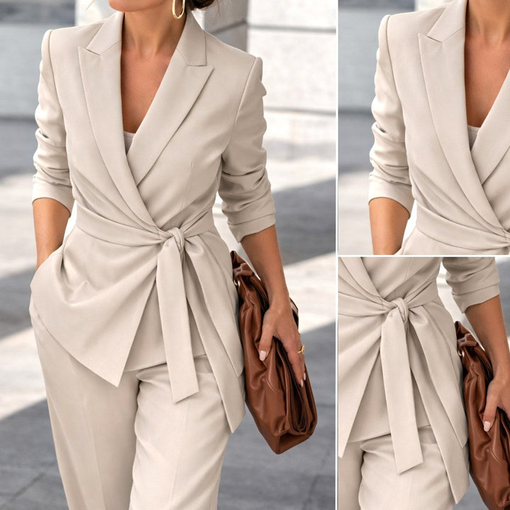 Fashionable women's two-piece set with a belted waist and trendy wide-leg trousers. Elegant ladies' suit.