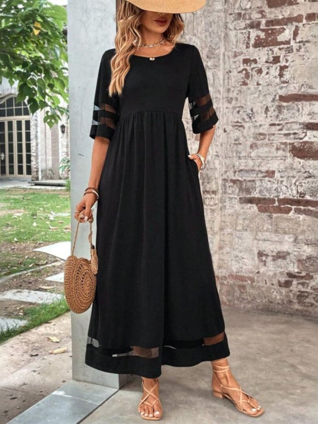 Women's black tummy control midi dress, flattering ruched bodycon design for an elegant evening or special occasion.