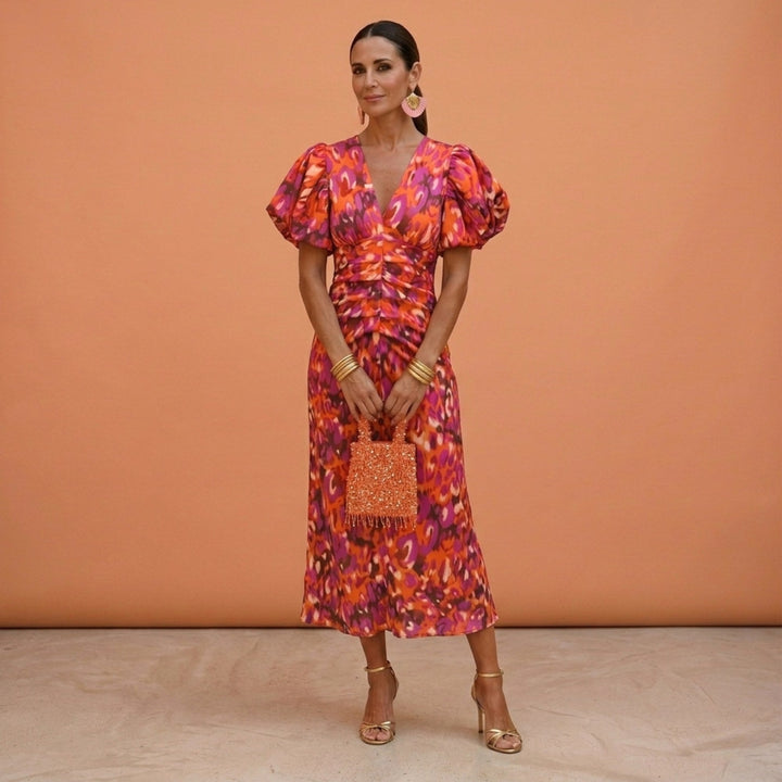 Women's elegant V-neck day dress with puffed sleeves, perfect for a chic, comfortable look.