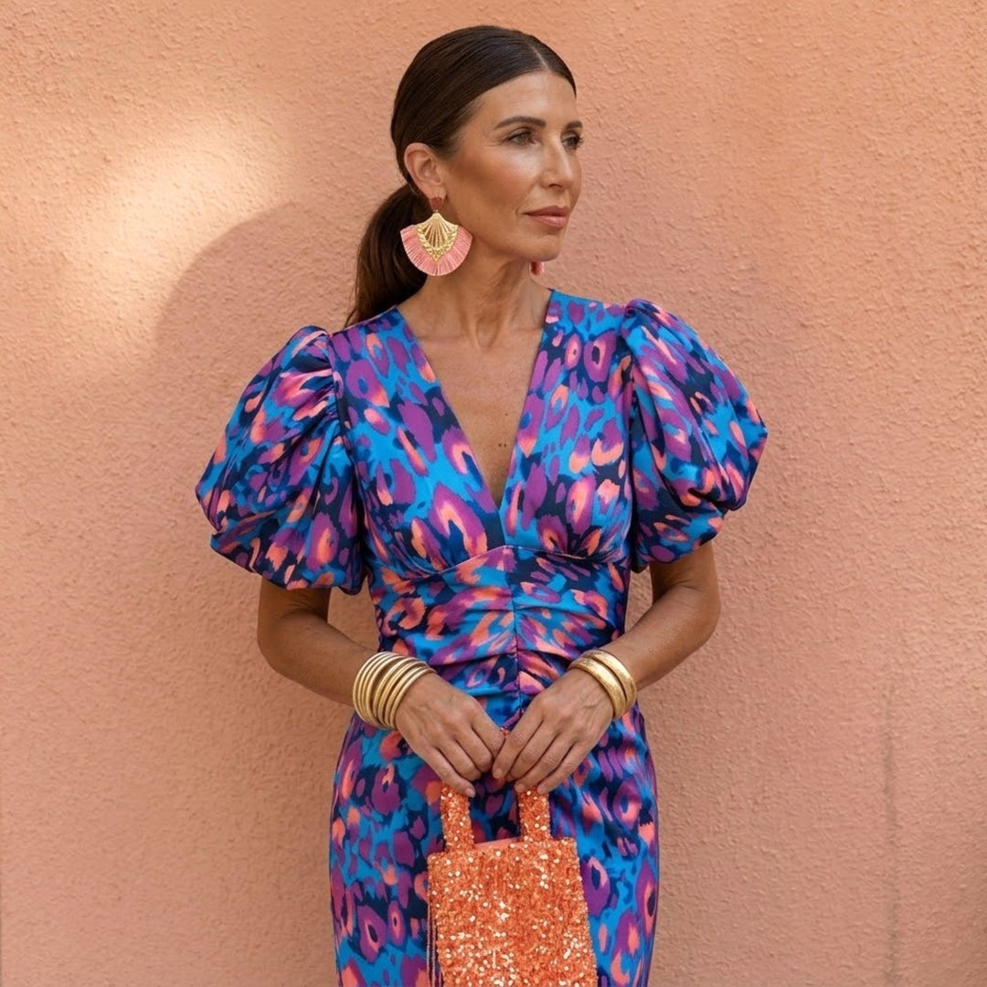 Elegant women's V-neck dress with puffed sleeves, suitable for casual yet sophisticated wear.