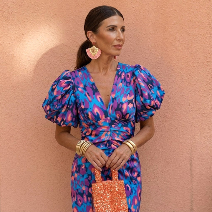 Elegant women's V-neck dress with puffed sleeves, suitable for casual yet sophisticated wear.