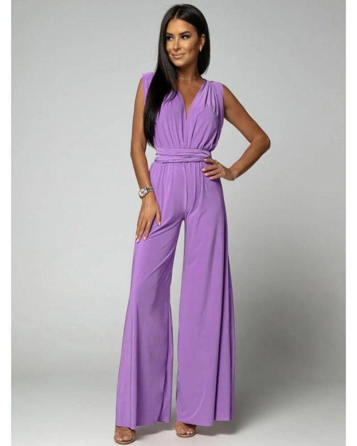 Stylish women's deep V-neck wide leg jumpsuit for formal events, offering an elegant and modern evening outfit.