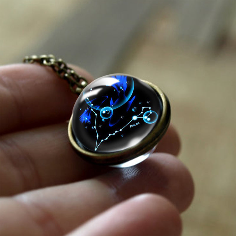 Close-up of a specific Zodiac glass pendant necklace, a personalized spiritual gift for women.