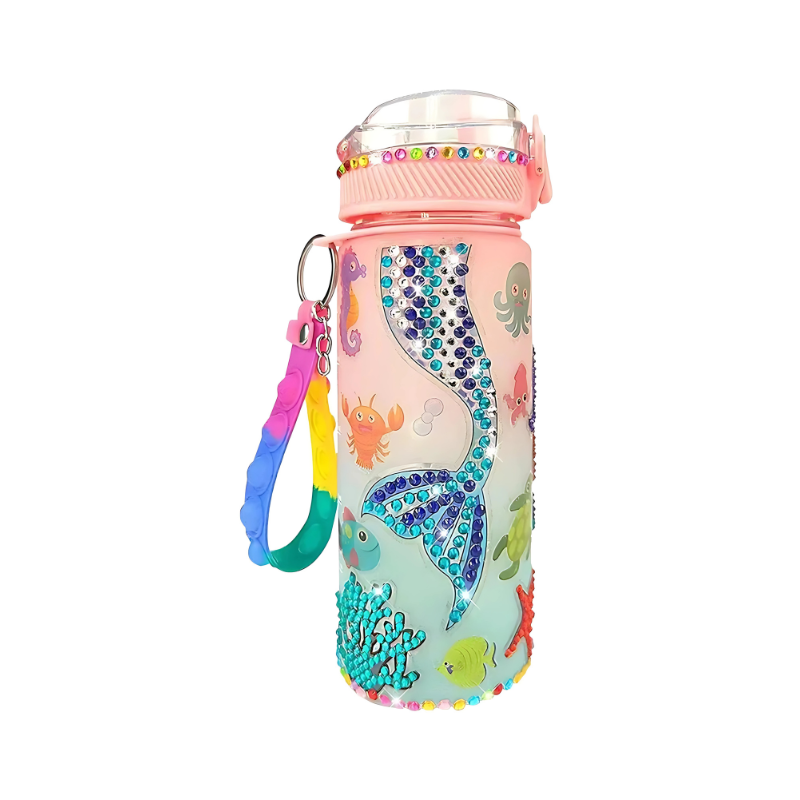Child decorating a glow-in-the-dark water bottle with a DIY craft kit. Fun art project & kids gift.