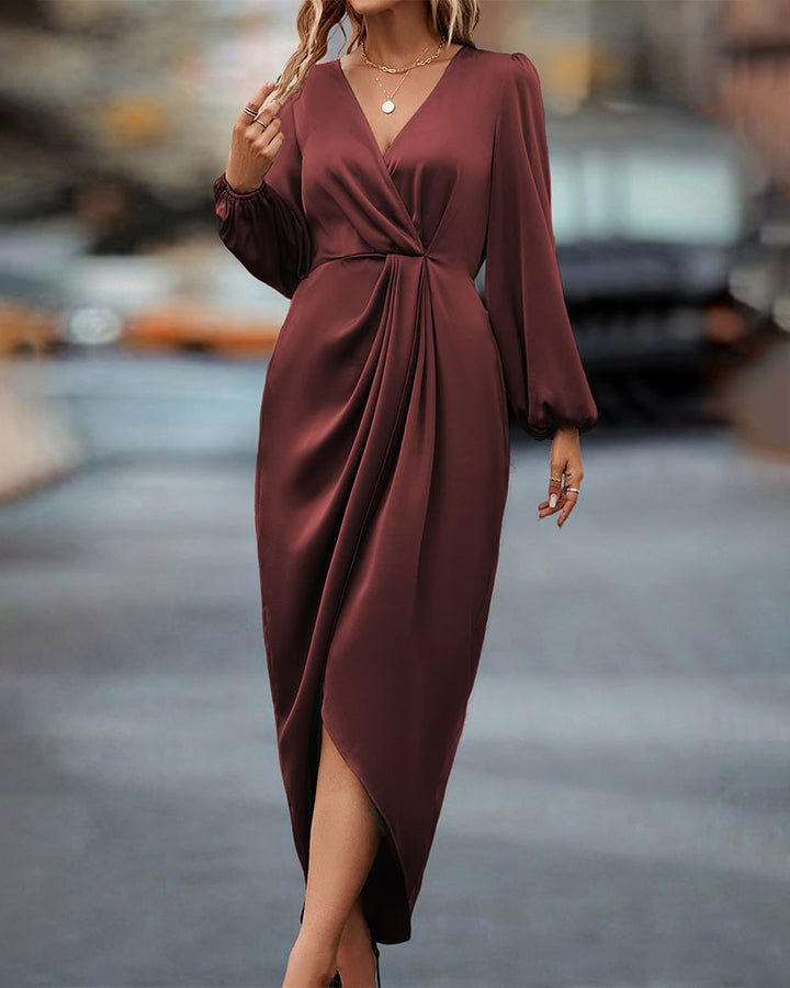 Women's beige A-line midi dress featuring a flattering V-neck and elegant lantern sleeves, offering a chic versatile style.